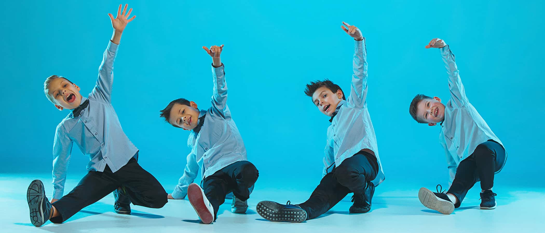 The kids dance school, ballet, hiphop, street, funky and modern dancers on blue studio background